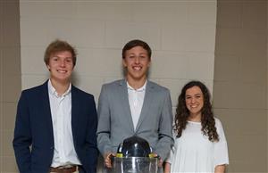 Ryne, Will, and Haley post with their invention