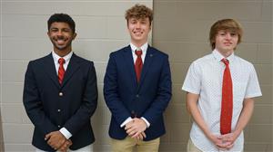 Noah, Kellen, and Jacob pose together after the Senior Design Showcase